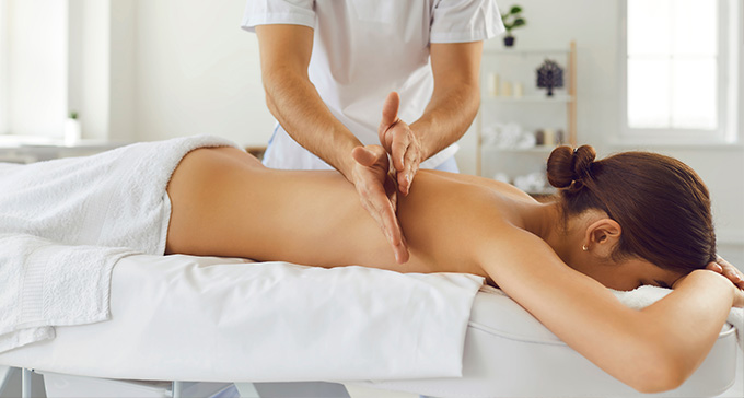 a woman being given a Swedish massage